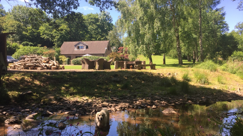 Forest Mill Holiday Cottage in the Brecon Beacons viewed from the River Monnow